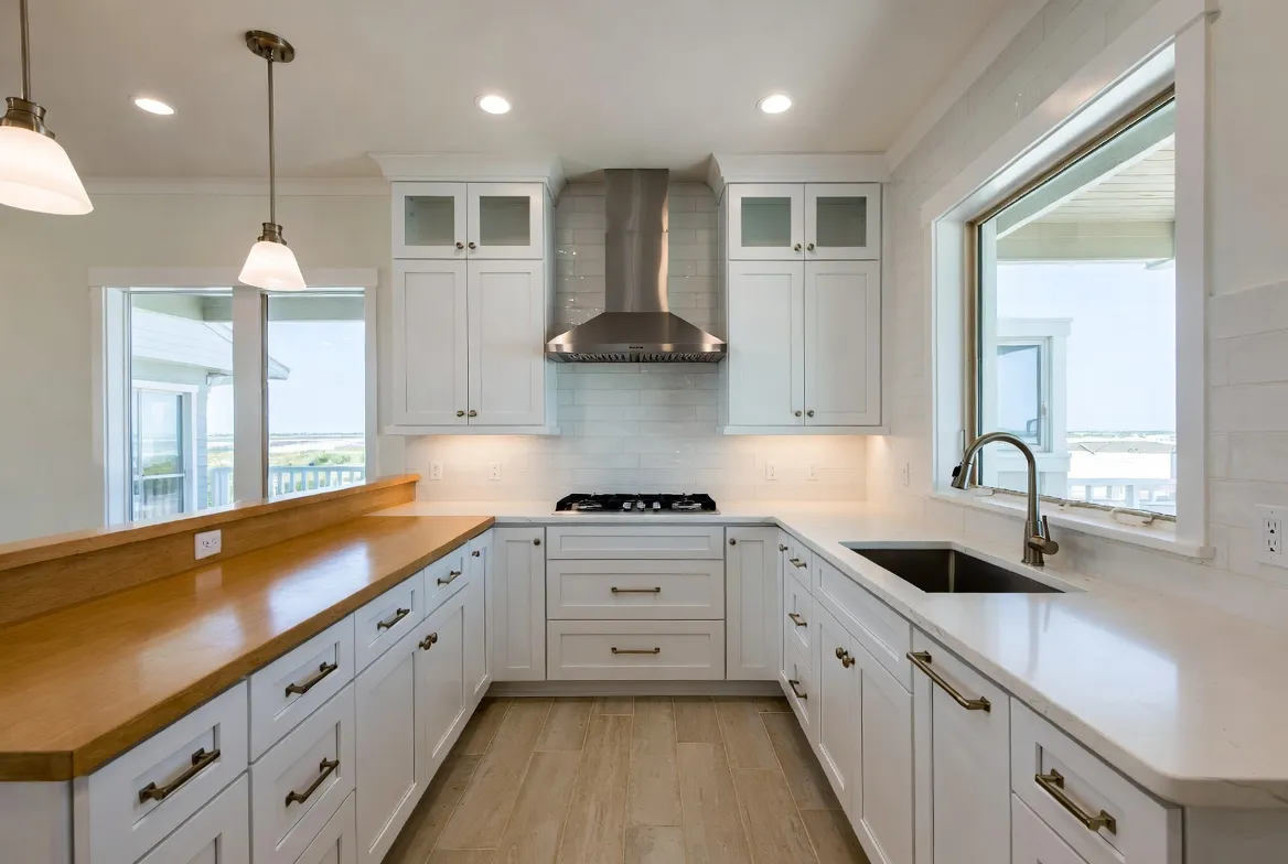 Bright coastal kitchen remodel with quartz counters and shaker cabinets in Naples, FL.